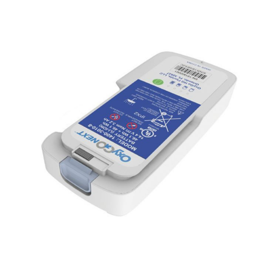 A rectangular white OxyGo Batteries For NEXT O2 Portable Concentrators battery with a blue info label, barcode, and gray latch at one end is shown on a white background.